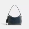 Geantă crossbody Dakota din denim de bumbac regenerativ cu pandantive