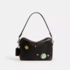 Geantă crossbody Dakota „Rexy 10Th Birthday” din piele uzată, cu imprimeu de autocolante