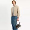 Geantă crossbody Dakota „Rexy 10Th Birthday” din piele uzată, cu imprimeu de autocolante