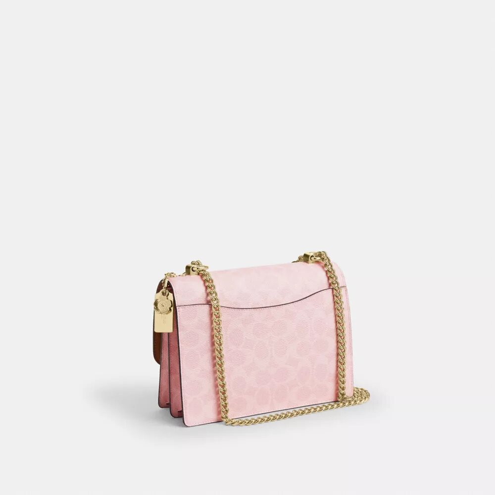 Geantă crossbody Klare din Signature Canvas cu pandantive
