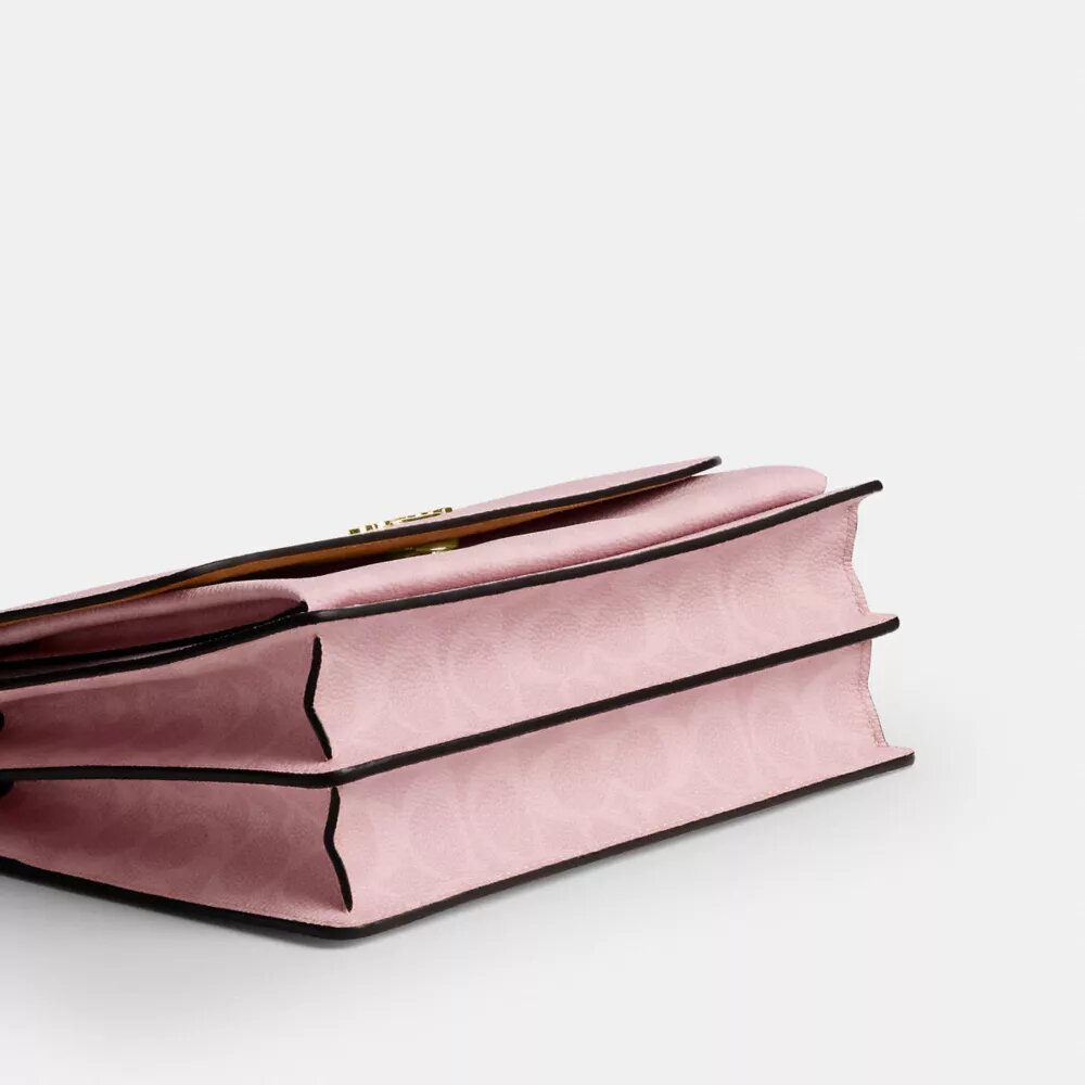 Geantă crossbody Klare din Signature Canvas cu pandantive