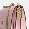 Geantă crossbody Klare din Signature Canvas cu pandantive