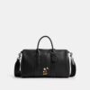 Geantă Disney X Coach Compass 35 cu Mickey Mouse