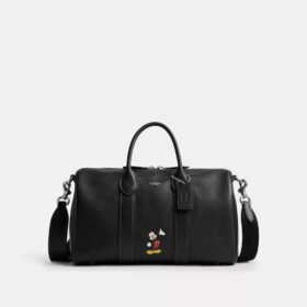 Geantă Disney X Coach Compass 35 cu Mickey Mouse