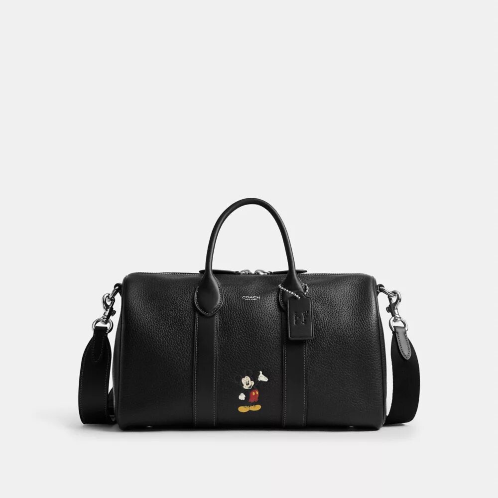 Geantă Disney X Coach Compass 35 cu Mickey Mouse