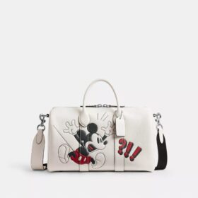 Geantă Disney X Coach Compass 35 cu Mickey Mouse