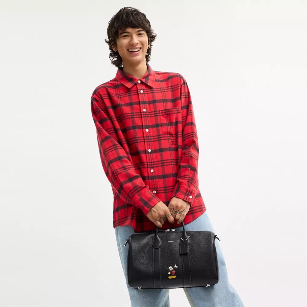 Geantă Disney X Coach Compass 35 cu Mickey Mouse