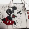 Geantă Disney X Coach Compass 35 cu Mickey Mouse