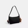 Geantă Leo Crossbody din nailon semnătura cu pandantive