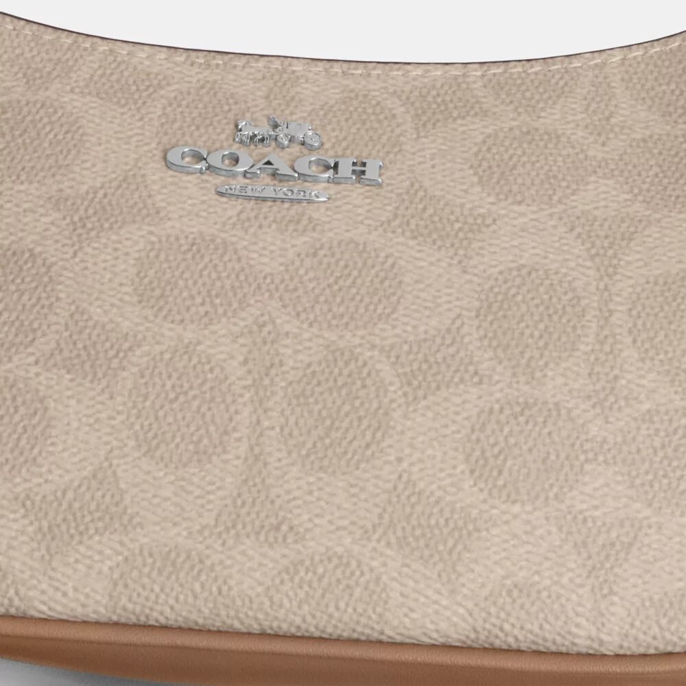 Geantă mini de purtat pe umăr Teri din Signature Canvas