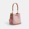 Geantă tip sac Rowan din Signature Canvas cu pandantive