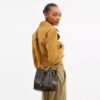 Geantă tip sac Rowan din Signature Canvas cu pandantive