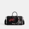 Geanta Disney X Coach Compass 35 cu Pluto