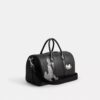 Geanta Disney X Coach Compass 35 cu Pluto