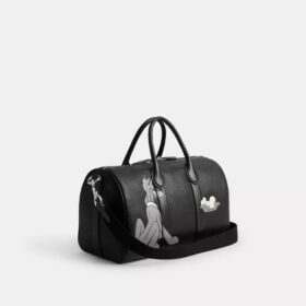 Geanta Disney X Coach Compass 35 cu Pluto