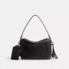 Gență crossbody Dakota din piele patinată, cu pandantive