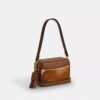Gență crossbody mini Carey din piele de vițel cu imprimeu de vacă