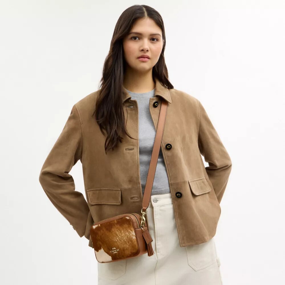Gență crossbody mini Carey din piele de vițel cu imprimeu de vacă