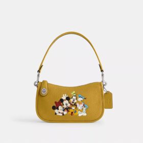 Gența Swinger Disney X Coach din piele regenerativă cu Mickey Mouse și prietenii săi