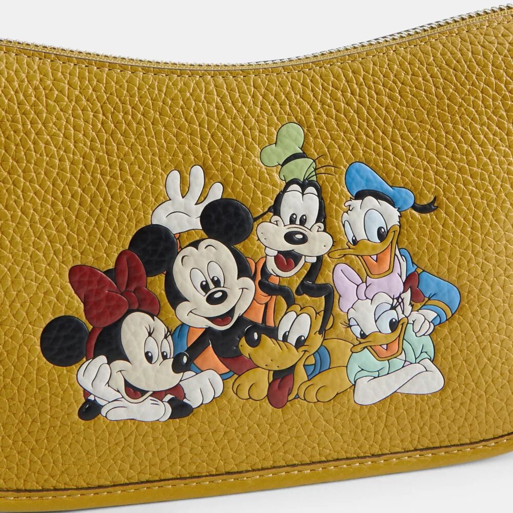 Gența Swinger Disney X Coach din piele regenerativă cu Mickey Mouse și prietenii săi