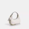 Genți crossbody Carmen mini cu curea transversală și nituri în formă de inimă