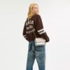Genți crossbody mini Klare cu curea transversală din Signature Canvas