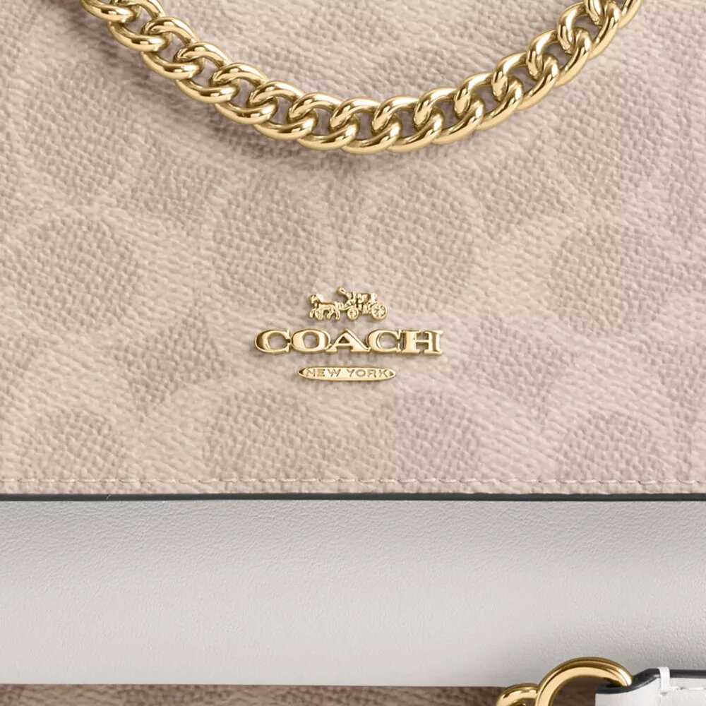Genți crossbody mini Klare cu curea transversală din Signature Canvas