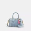 Genți crossbody mini Rowan din denim uzat, cu pandantive