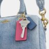 Genți crossbody mini Rowan din denim uzat, cu pandantive