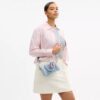 Genți crossbody mini Rowan din denim uzat, cu pandantive