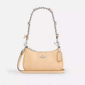 Genți crossbody Teri cu fundițe, purtată pe umăr