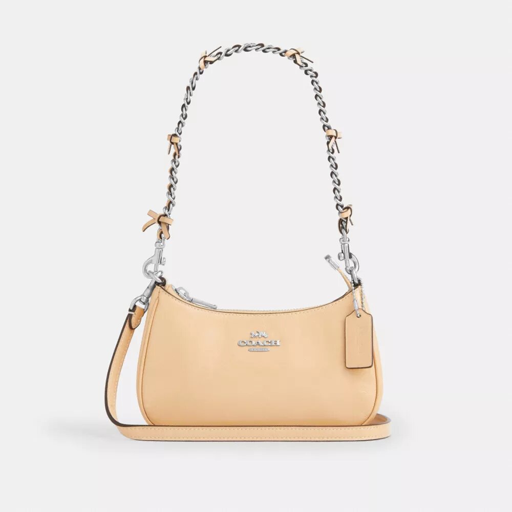 Genți crossbody Teri cu fundițe, purtată pe umăr