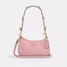 Genți crossbody Teri cu fundițe, purtată pe umăr