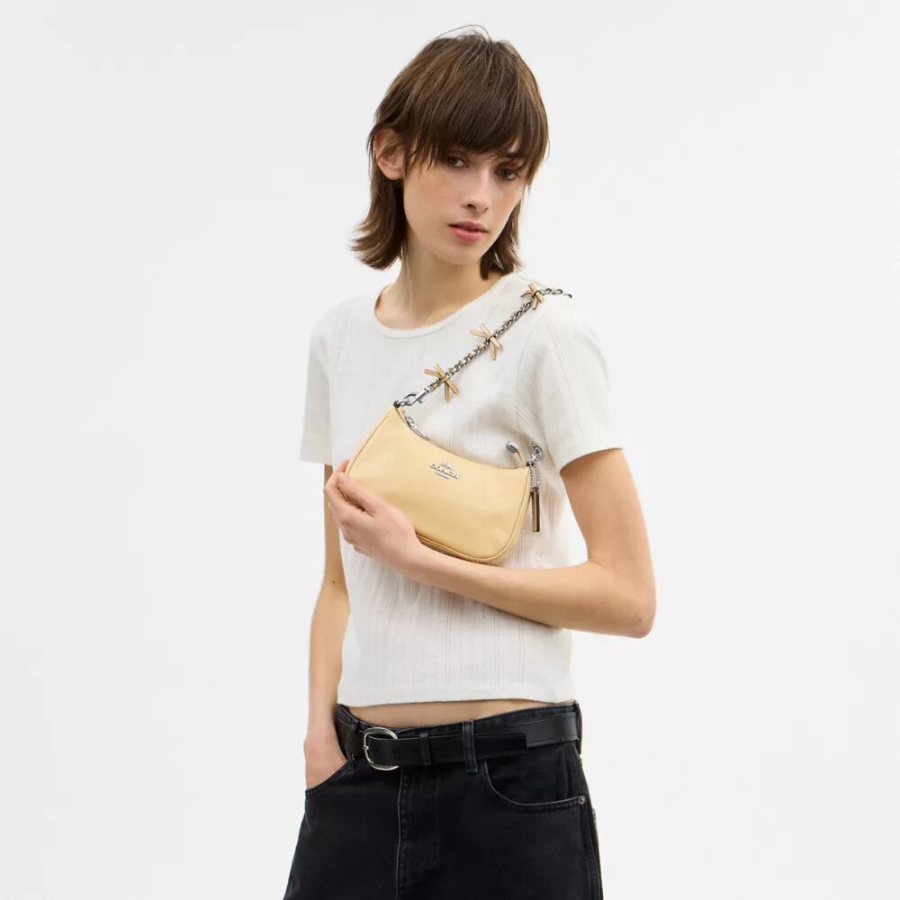 Genți crossbody Teri cu fundițe, purtată pe umăr