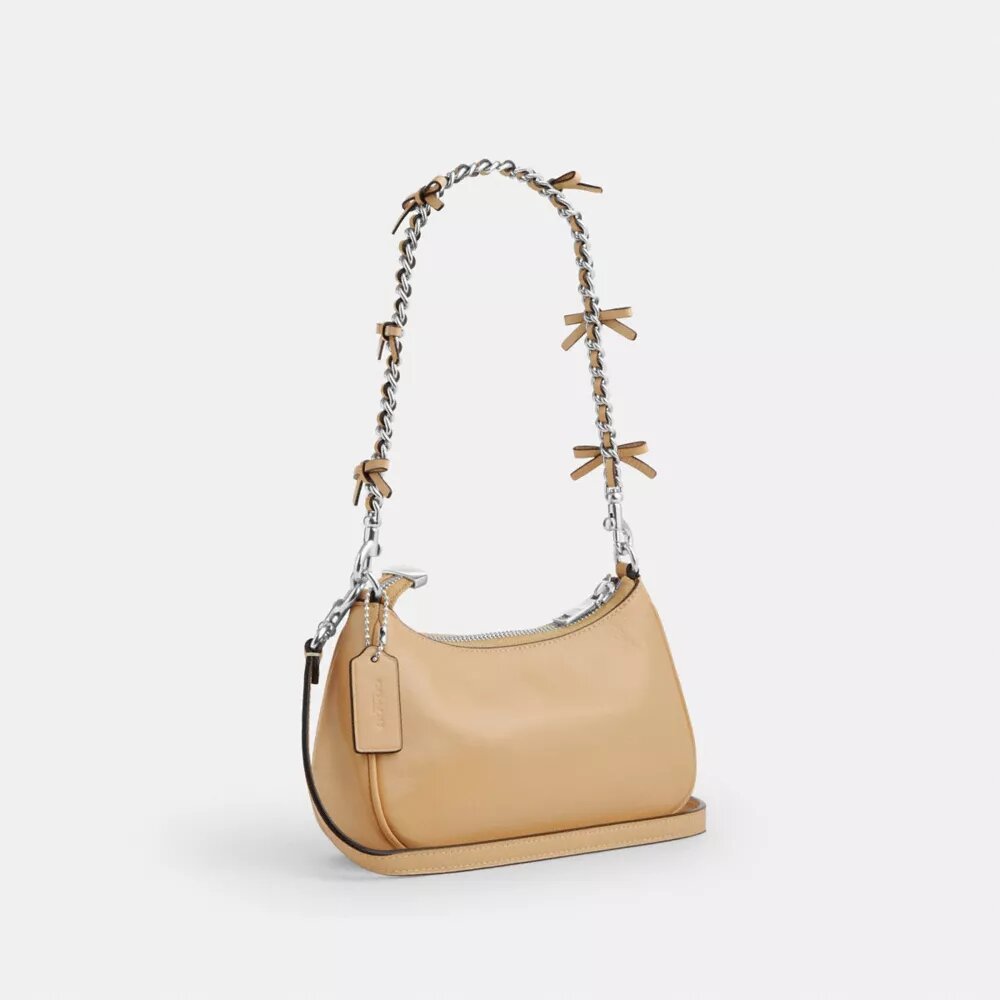 Genți crossbody Teri cu fundițe, purtată pe umăr