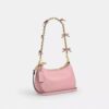 Genți crossbody Teri cu fundițe, purtată pe umăr
