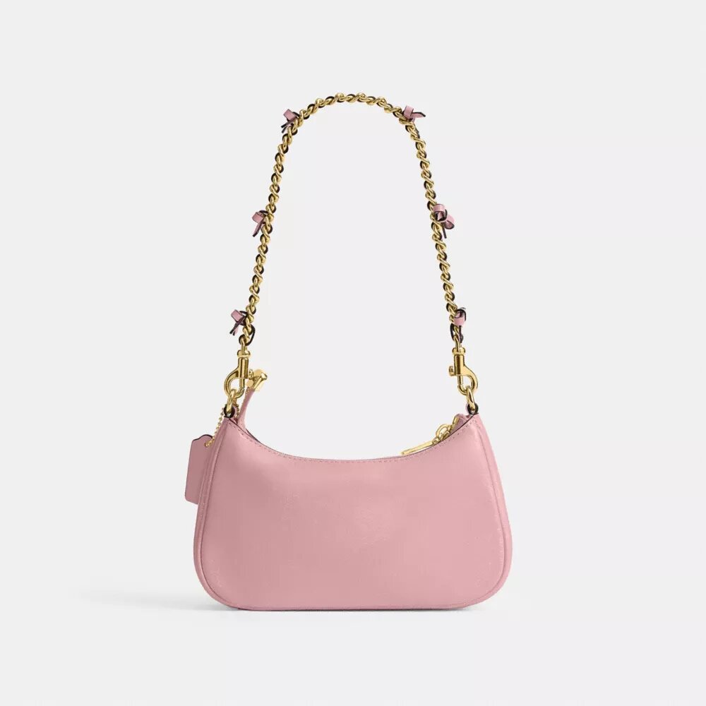 Genți crossbody Teri cu fundițe, purtată pe umăr