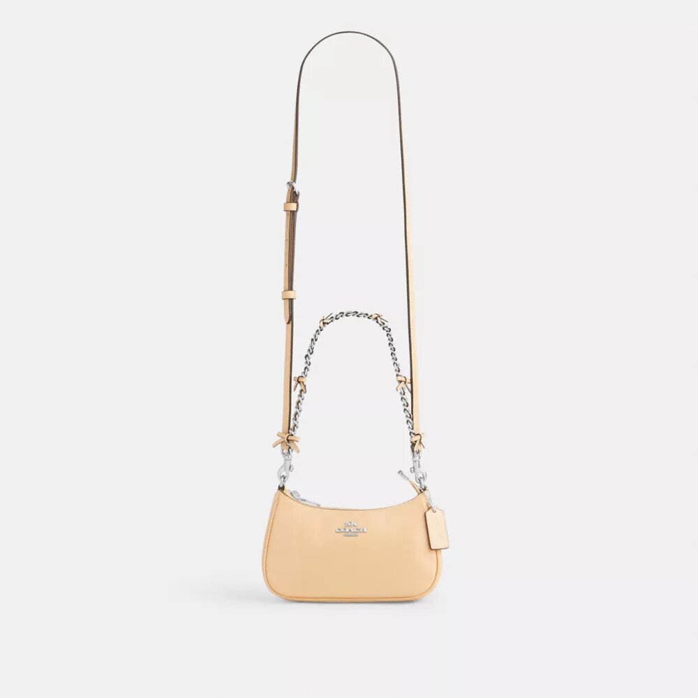Genți crossbody Teri cu fundițe, purtată pe umăr