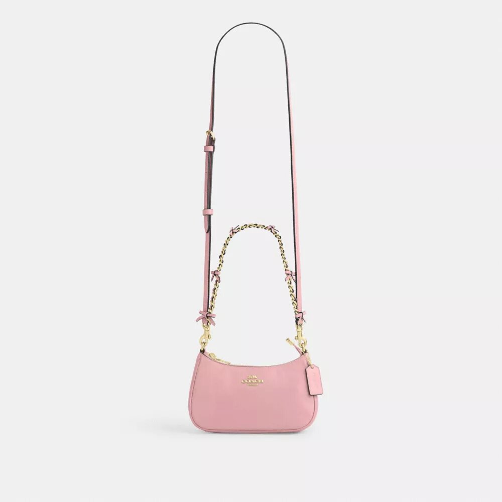 Genți crossbody Teri cu fundițe, purtată pe umăr