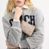Portofel de mână cu fermoar în colț, din Signature Canvas cu imprimeu floral