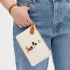 Portofel de mână mic Disney X Coach Essential din piele regenerativă cu Mickey Mouse